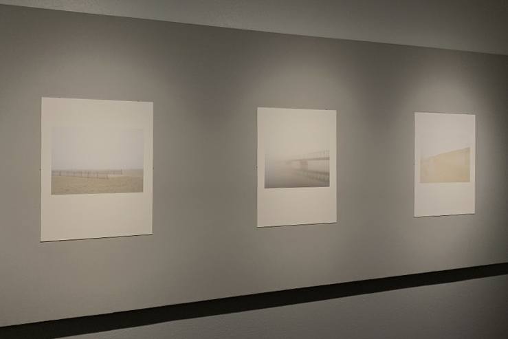 Three of Mark Ludak's photographs hang on the walls of the Irene Carlson Gallery.
